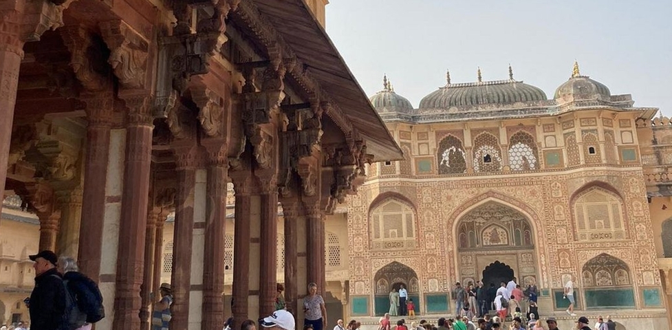 Historical building with intricate architecture and people.