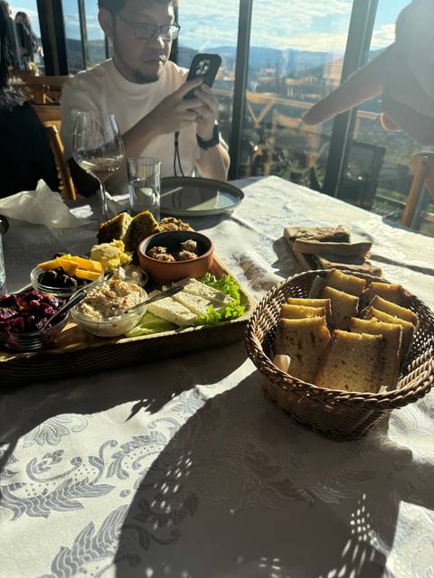 Assorted appetizer platter on a dining table.