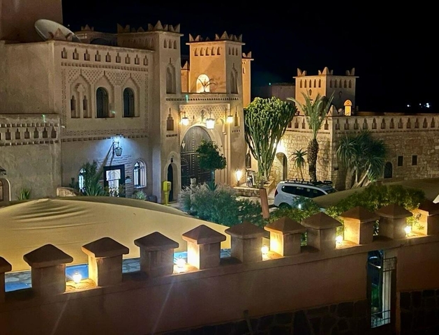 Lit traditional building during nighttime.