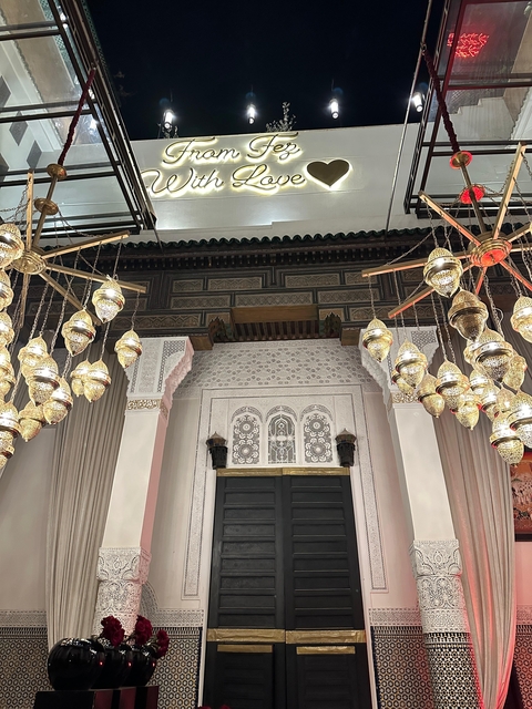 Interior of a traditional Moroccan building with hanging lamps.