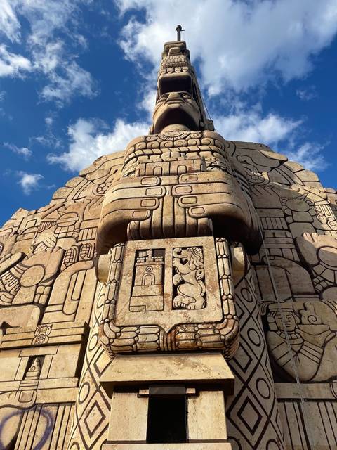 Ancient stone carving with symbolic patterns.