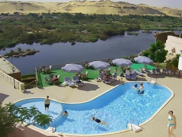 Outdoor pool area overlooking a river.