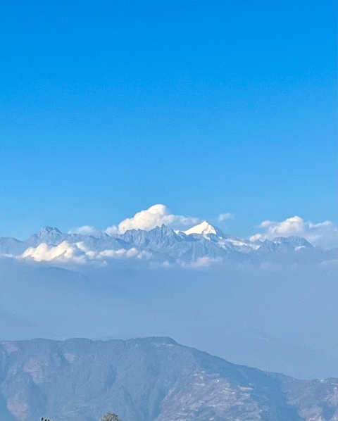 Snow-capped mountain peaks under a clear blue sky.
