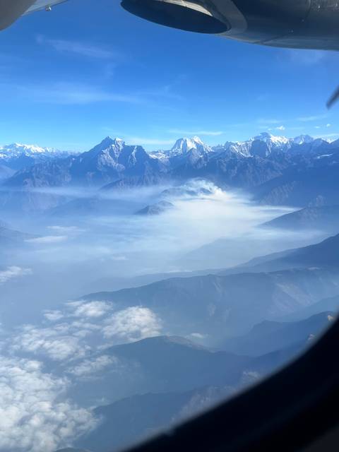 Mountain range covered with mist and snow.