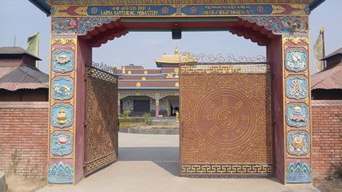 Decorative gate to a monastery with ornate design.