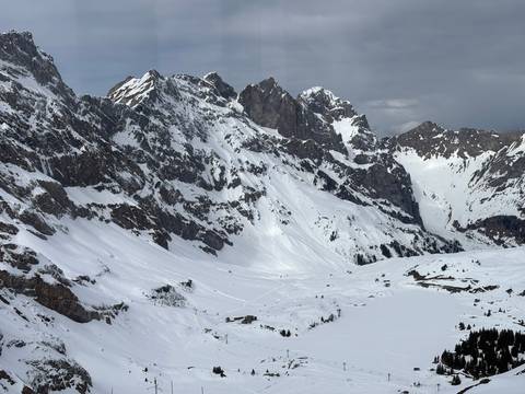 Imposing snowy mountains with jagged peaks.