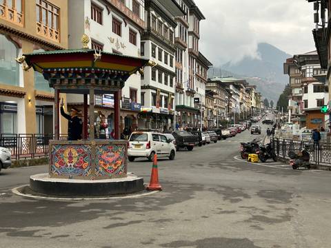 Street scene in a Bhutanese city with traditional architecture.