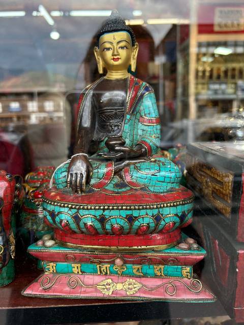 Decorative Buddha statue displayed in a shop.