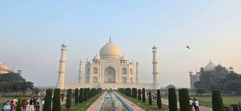 The Taj Mahal in Agra with a reflection in the foreground pool.