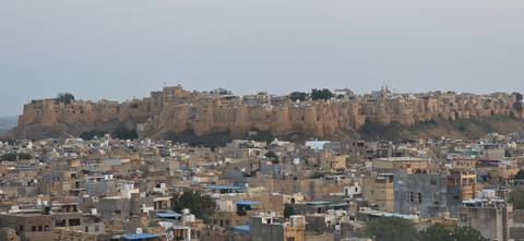 A view of Jaisalmer Fort with a city below.