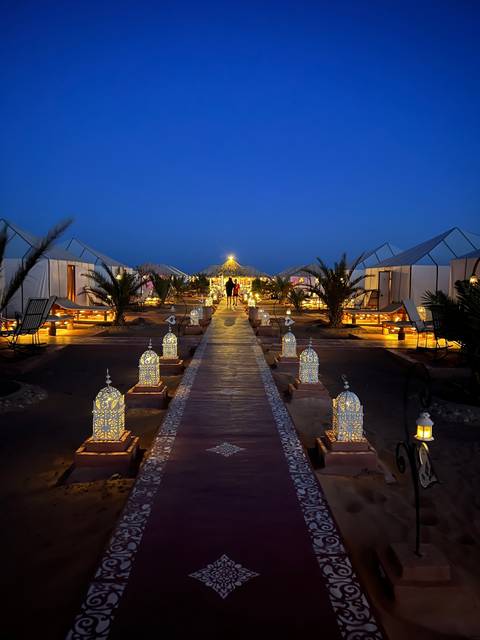 Luxurious campsite with lights at night.