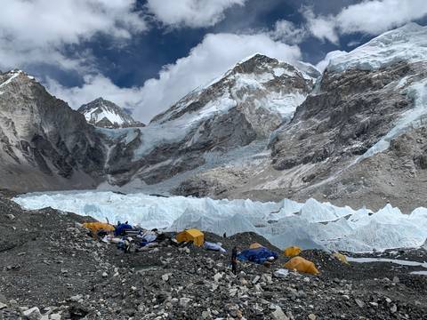 Everest Base Camp with tents and snowy peaks.