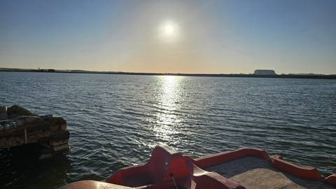 Large body of water reflecting sunlight.