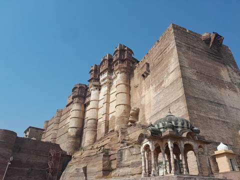 Majestic fort structure against a clear sky.