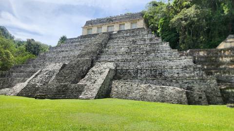 Ancient ruins surrounded by greenery.