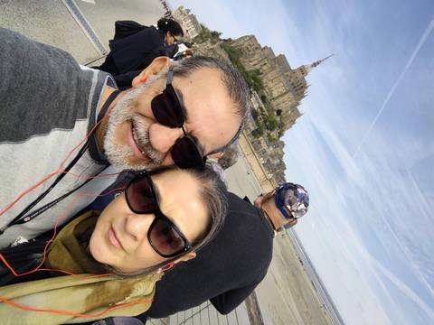 Two people in front of Mont Saint-Michel.