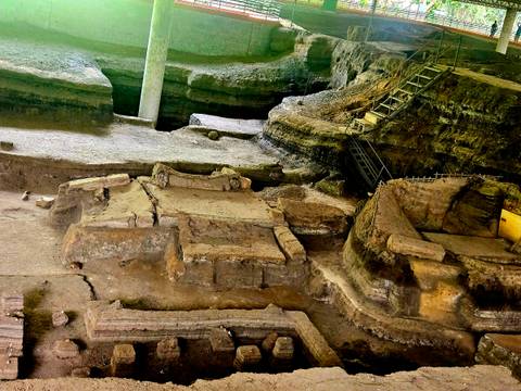 Ruins of ancient buildings at an excavation site.