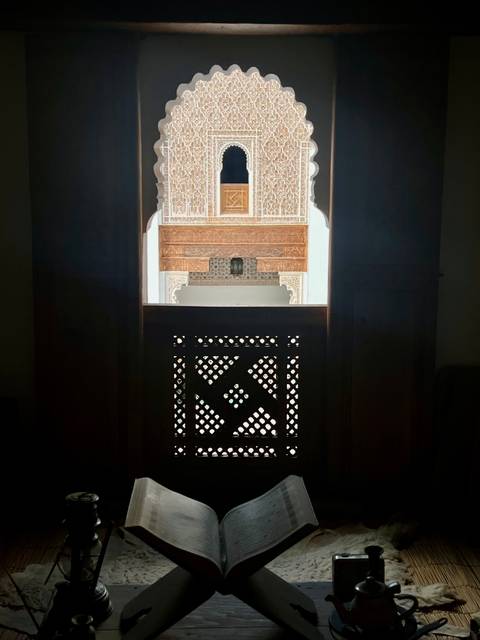 Dark interior with a view of intricate wooden design.