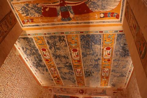Colorful painted ceiling with ancient Egyptian hieroglyphs.