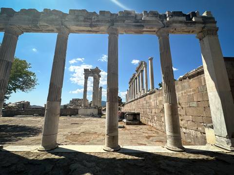 Ancient Greek ruins with stone columns.