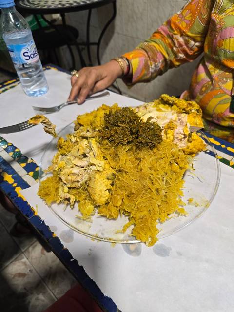 Plate of traditional Moroccan food being served.