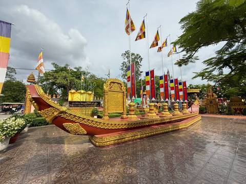 Decorated boat on display with flags.