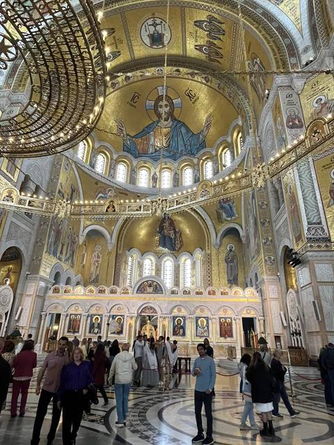 Interior of a grand cathedral with ornate decorations.