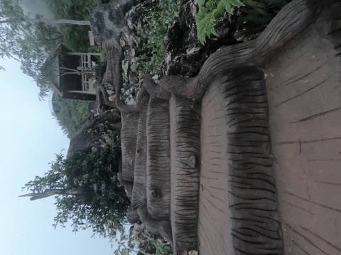 Close-up view of stairs running up a rocky hill.