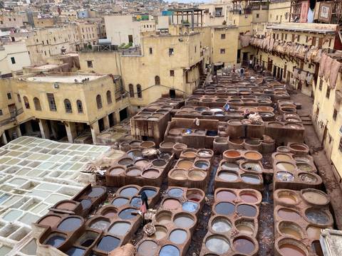 Aerial view of a traditional tannery with leather dyeing pits.