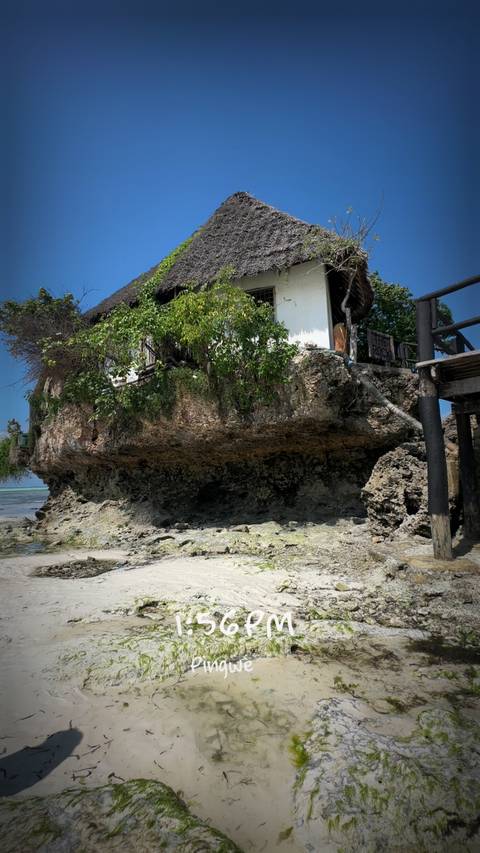 A house built on a rocky seaside cliff.