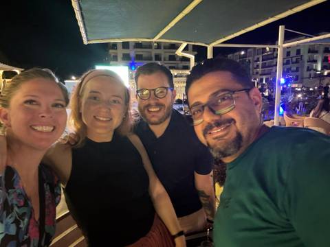 Group of friends enjoying a night out in a lively setting.