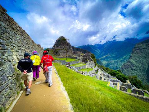 Tourists exploring the ruins of Machu Picchu.