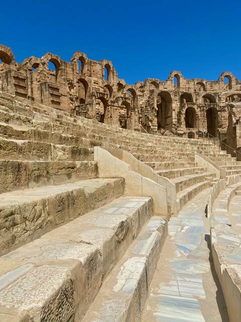 Ancient stone amphitheater with detailed architecture.