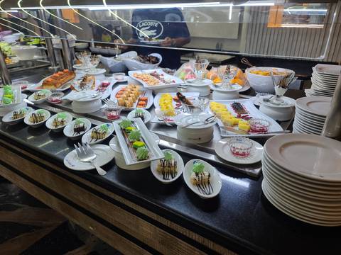 Buffet spread with an array of dishes and desserts.