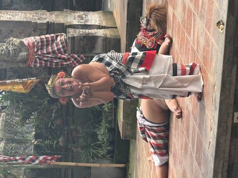 Traditional performer in costume on a stage.