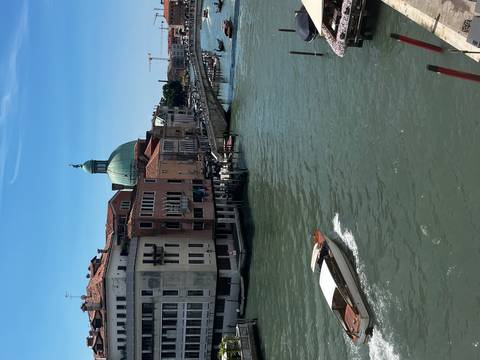 Scenic view of a canal with a boat in Venice.