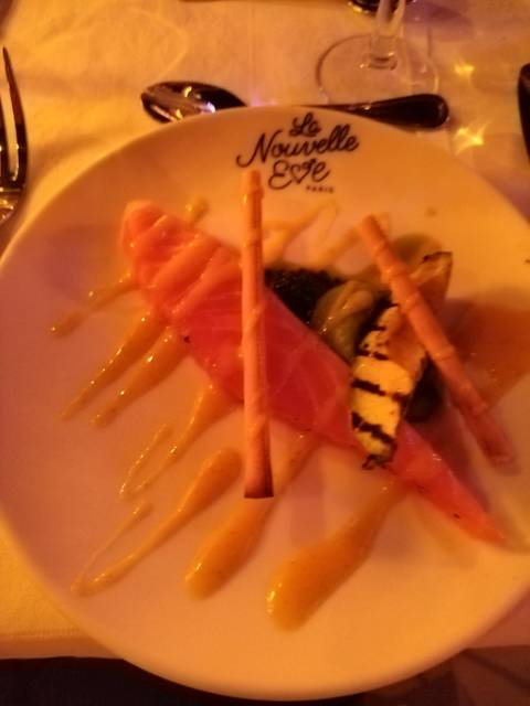 A close-up of a dish with salmon and vegetables.