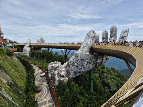 Golden Bridge at Da Nang with large stone hands supporting the structure.