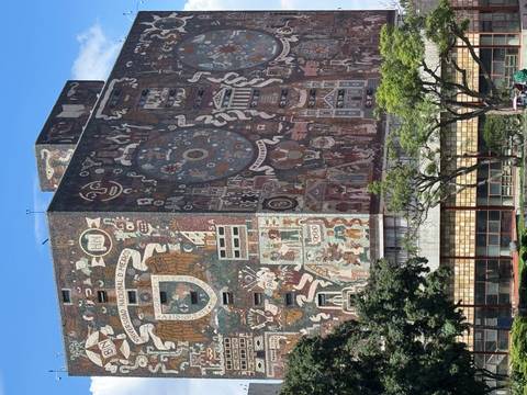 Building with intricate murals depicting historical scenes.