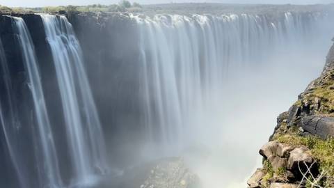 Victoria Falls with cascading water and mist.