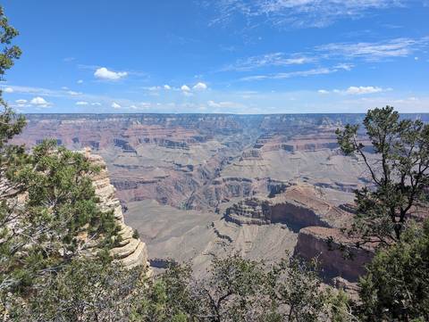 Grand Canyon with layered rock formations under a clear sky.