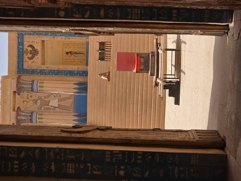 Entrance to an elaborately painted ancient building.