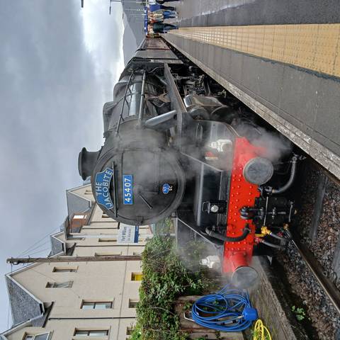 The Jacobite steam train at a station.