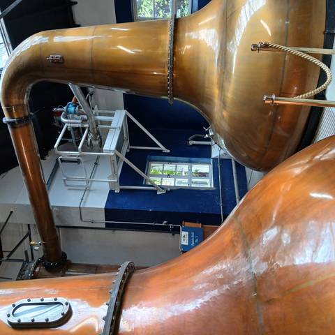 Interior of a distillery with copper stills.