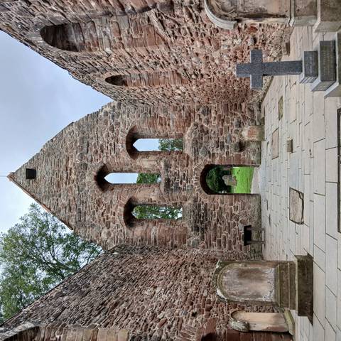 Ruined medieval stone church.