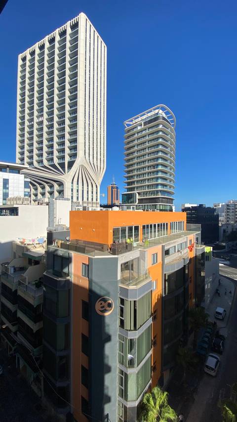 Modern cityscape with colorful buildings.