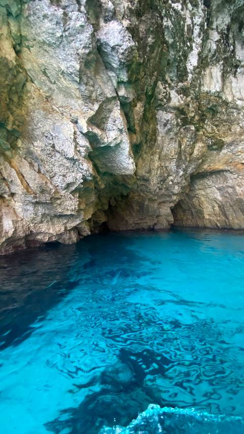 Coastal cave with azure water.