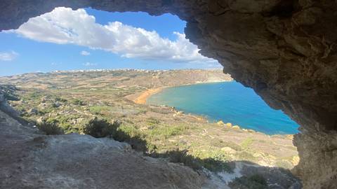 Scenic coastal landscape viewed from a cave.