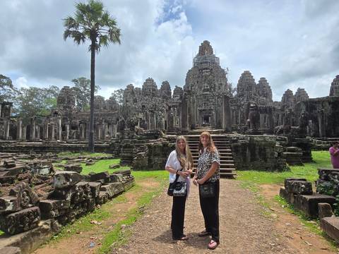 Tourists at Angkor temple ruins.