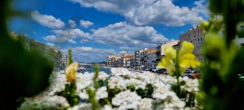 A scenic view of a canal with buildings on either side.